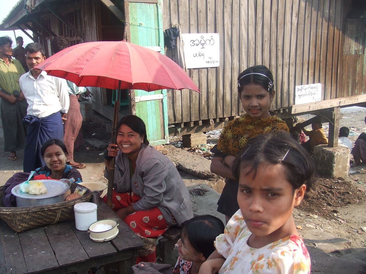 It seems they are as interested in me as I was in them. Burmese fish market women and guests!