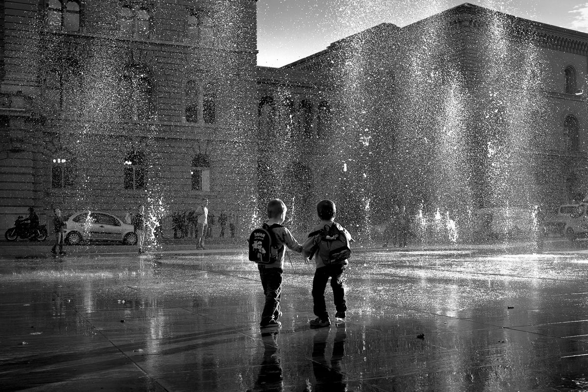 Kids playing with water jets, Bern, Switzerland